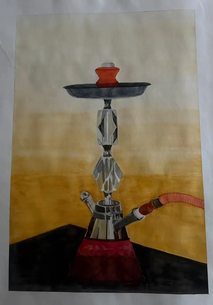 Hookah: a hookah with a faceted glass stem, a red base, and a coiled hose stands on a dark table