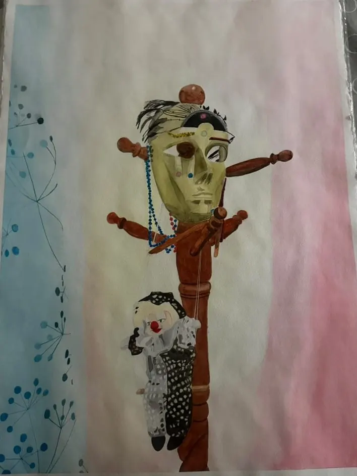 Mask and Clown: a golden mask draped with beads sits on a turned wooden stand, with a small clown doll leaning at its foot