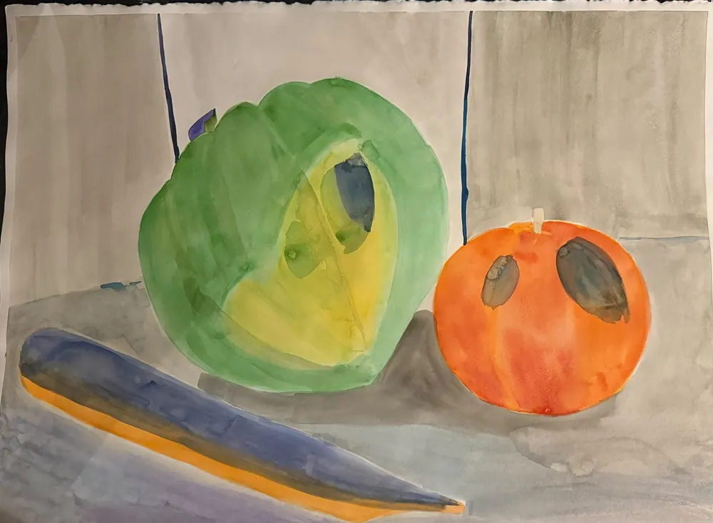 Melon and Orange: a green melon cut open and a bright orange sit behind a long blue-and-yellow shape lying across a grey tabletop